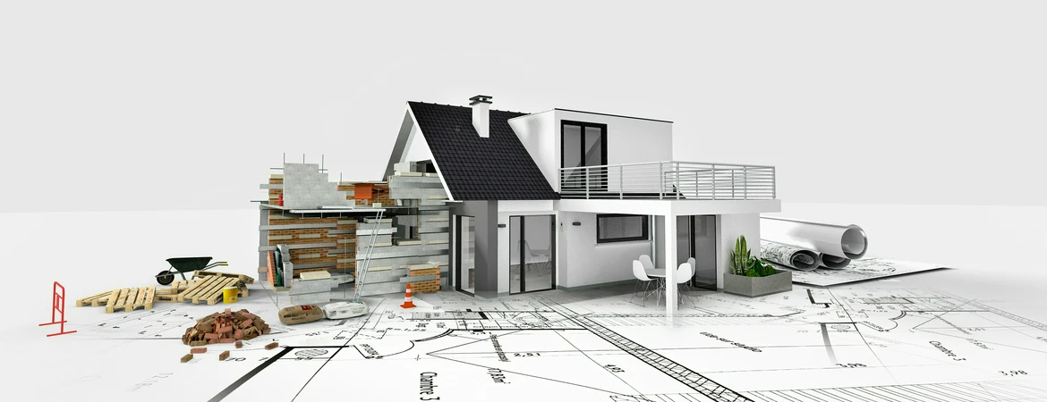 Prawo nieruchomości makieta domu stojąca na&nbsp;planach nieruchomości